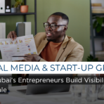 Social media and start-up growth concept showing an entrepreneur analysing performance data and building brand visibility through digital channels.