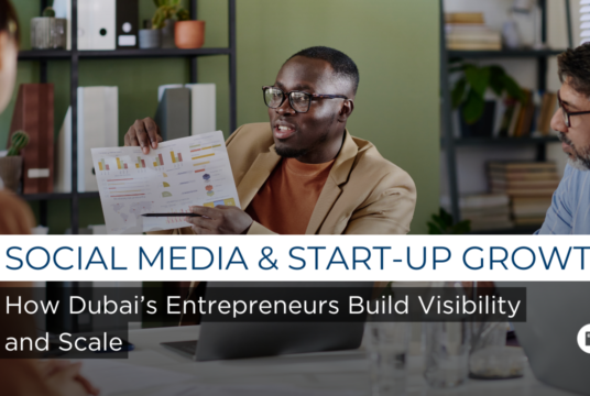 Social media and start-up growth concept showing an entrepreneur analysing performance data and building brand visibility through digital channels.